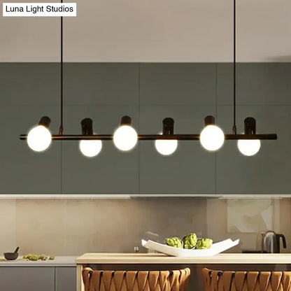 Modern black metal ceiling light with five glowing black naked bulb spheres for dining room island by DecorBites™