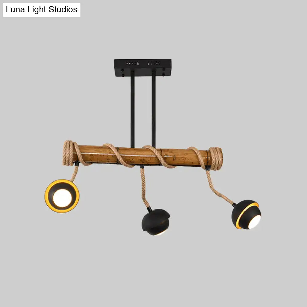 Decorbites industrial linear chandelier with bamboo tube and rope featuring black iron rods and adjustable spotlights in black and gold