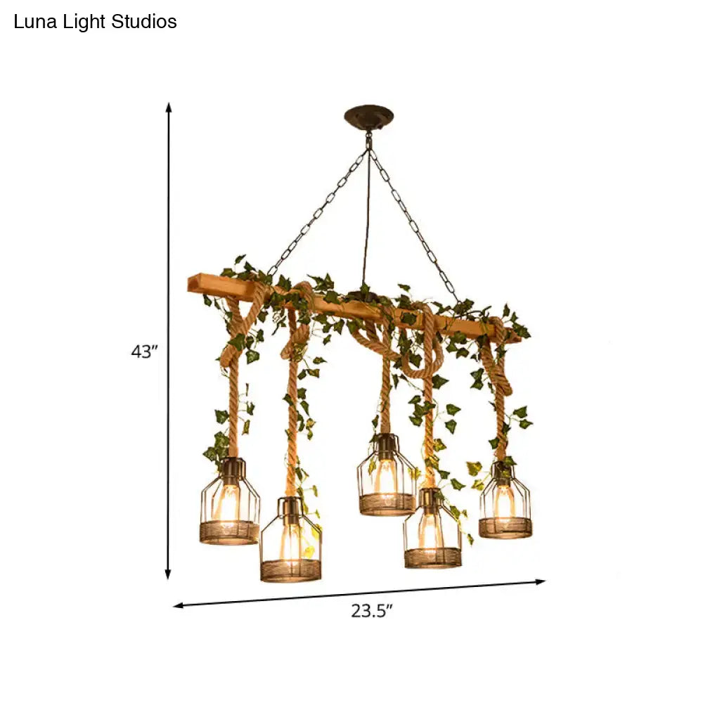 Rustic brown wooden chandelier with hanging glass lanterns and ivy vines resembling an industrial metal caged island pendant light