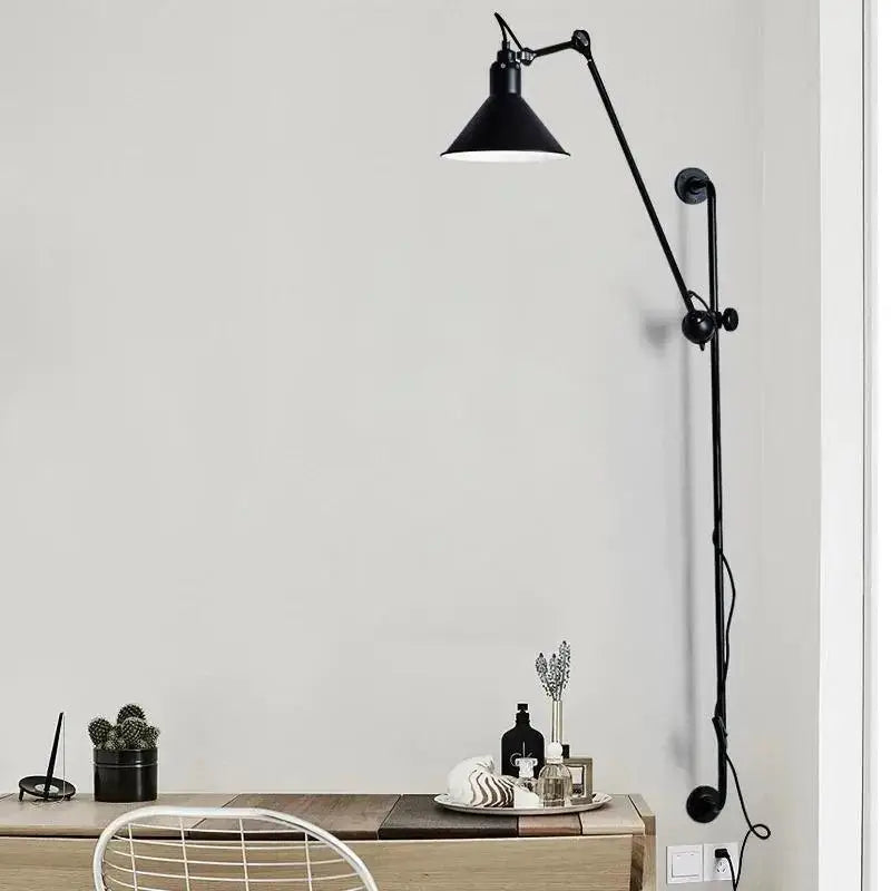 Black industrial-style DecorBites™ haley wall sconce with articulated arm and conical shade for modern home decor