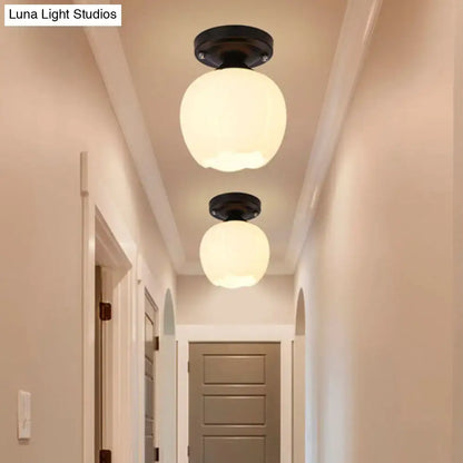 Decorbites industrial semi flush light with black metal fixtures and two round black opal glass globe shades for corridor lighting