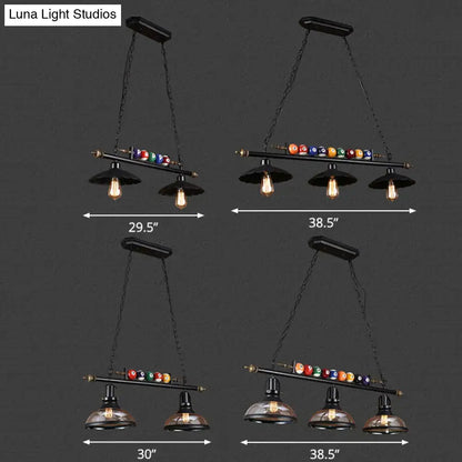 Industrial style black metal billiard light pendant with vintage edison bulbs and chain cord length above colorful balls