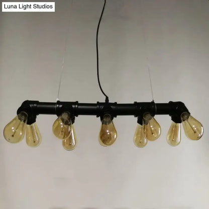 Industrial style ceiling light fixture featuring black metal piping and five amber glass filament bulbs for dining room use