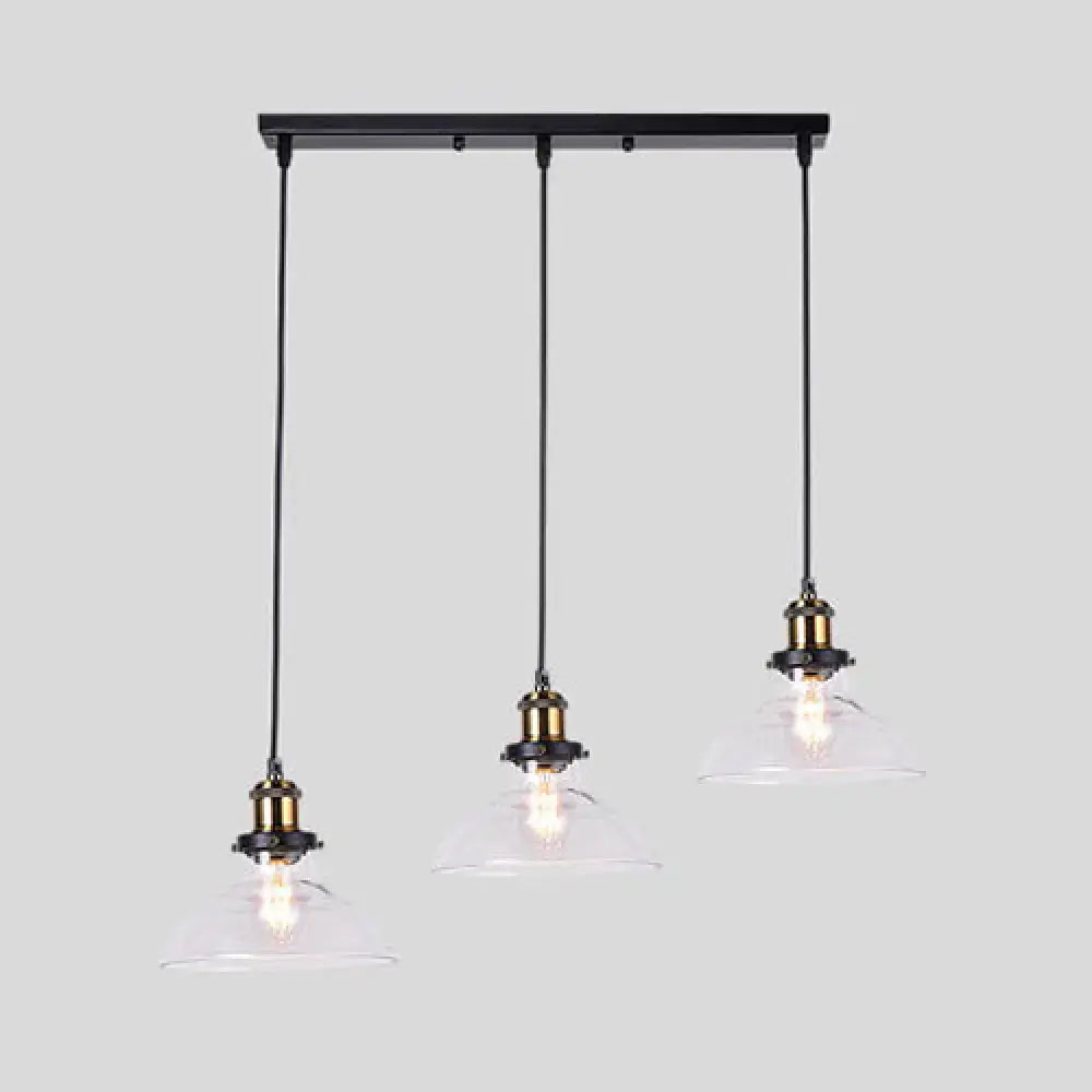 Black metal industrial style brass pendant light kit with three clear glass round barn admix hanging lamps