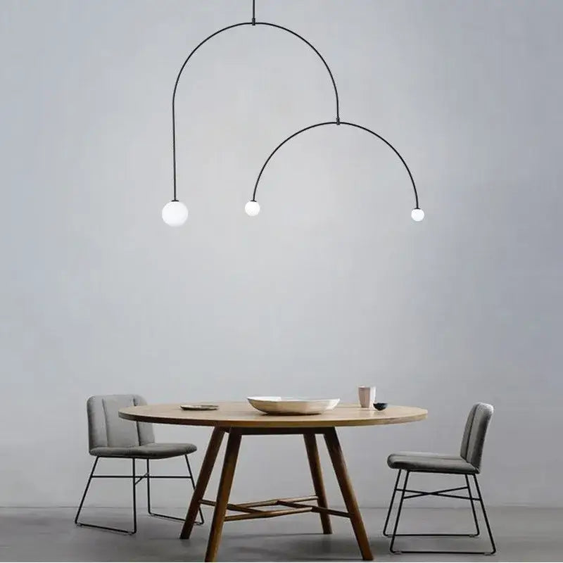 Minimalist decorbites iron balance black iron chandelier with three white spherical bulbs in an arched design for living room