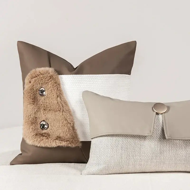 Decorbites italian luxury brown leather pillowcase featuring brown and white textured throw pillows with faux fur accents and metallic buttons