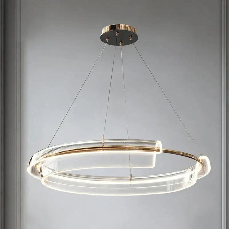 Modern double-ring pendant light with clear acrylic rings and gold-toned metal accents decorbites italian minimalist chandelier