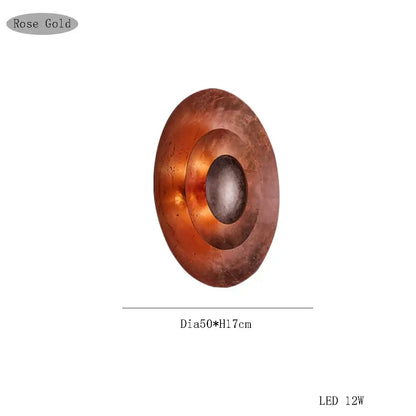 Rose gold circular led wall sconce with concentric ring design by decorbites italian vintage for living room use