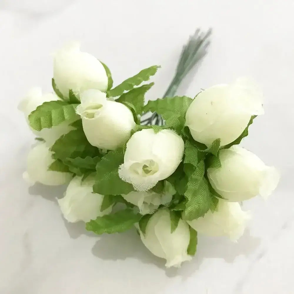 A delicate decorbites ivory flower bouquet with artificial white roses and flower cherry stamen for wedding decor