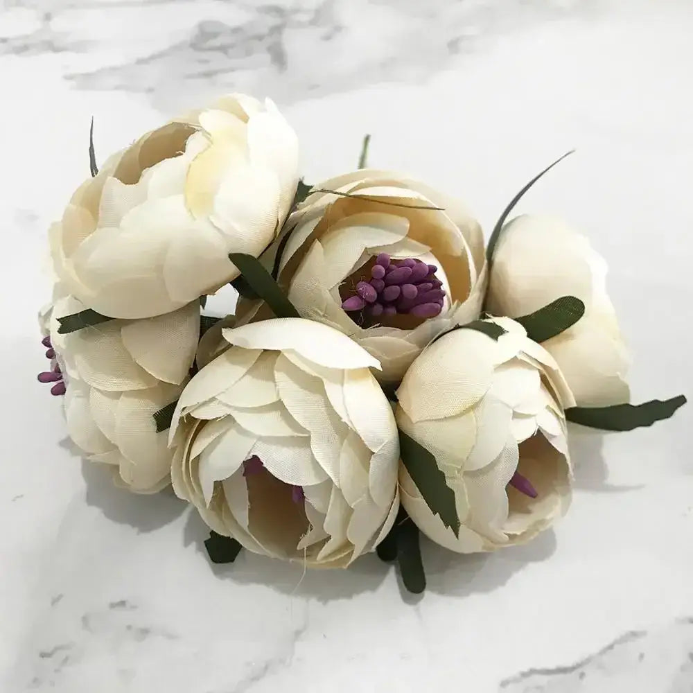 A delicate decorbites ivory flower bouquet with cream artificial peonies and flower cherry stamen for wedding decor