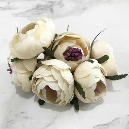 A delicate decorbites ivory flower bouquet with cream artificial peonies and flower cherry stamen for wedding decor
