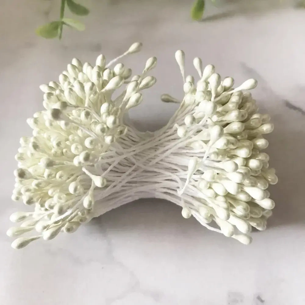 A bundle of decorbites ivory flower cherry stamen berries with delicate white paper flowers for wedding decor