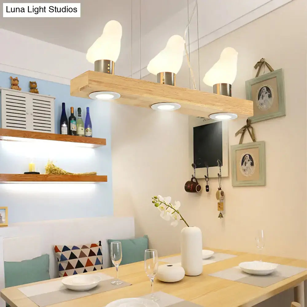 DecorBites ivory glass bird island pendant lighting with wooden beam and three white glass bird island lampshades