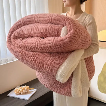 A plush pink quilted blanket with soft white fleece lining from decorbites jacquard lamb wool collection for cozy comfort