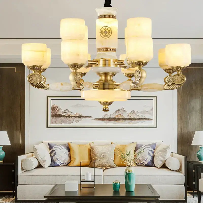 Gold-toned decorbites jade copper chandelier with frosted white opal glass shades and ornate carved detailing for living room