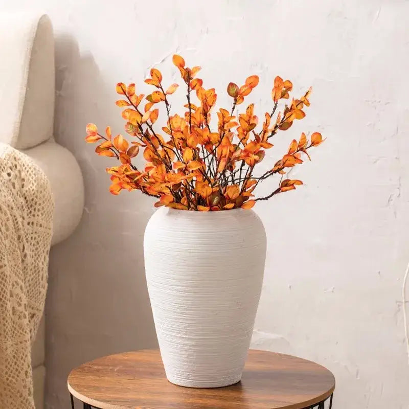 White ceramic hydroponic vase with vertical ribbed texture holding orange artificial leaves in decorbites™ japanese minimalist hydroponic vase set