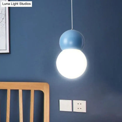 Decorbites kids bedside pendulum light with matte blue upper sphere and milky glass globe macaron ceiling pendant