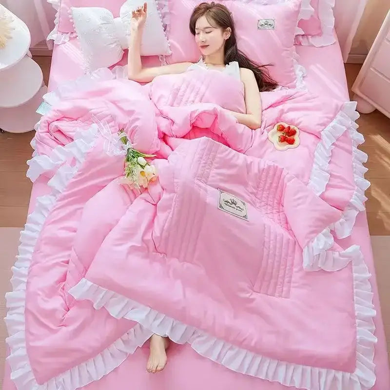 Pink ruffled summer quilt set with white lace trim and subtle embroidered label from decorbites korean princess ruffles collection
