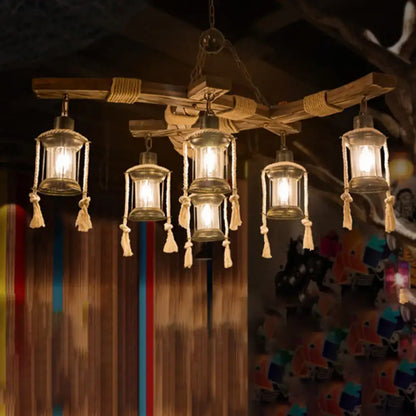 Rustic wooden DecorBites™ lantern restaurant island light with five clear glass lanterns featuring beige rope and tassels compatible with led incandescent fluorescent bulbs