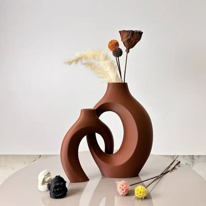 Terracotta-colored ceramic large dried vase with modern abstract interlocking curved forms from decorbites dried vase set