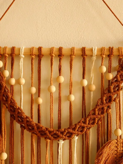 DecorBites™ leaf macrame wall hanging with warm brown and cream cords, wooden beads, and braided arch design for boho decor