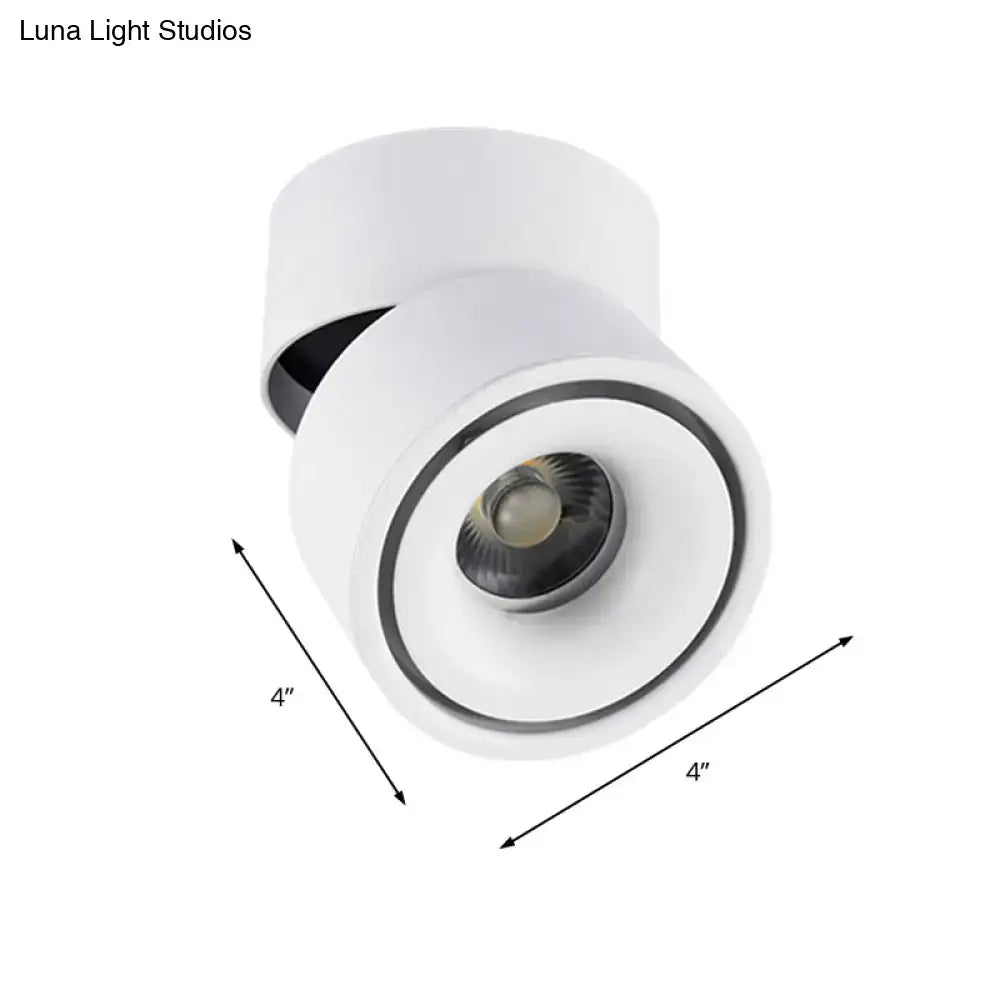 White cylindrical recessed spotlight with metallic shade and black accent ring featuring adjustable color temperature and max bulb wattage