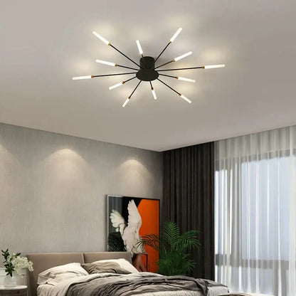 Modern black DecorBites™ LED ceiling chandelier light with slender arms and glowing white LED bulbs in Nordic design
