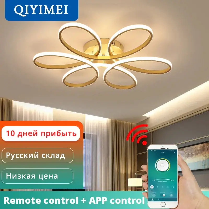 Gold-toned decorbites led ceiling light with flower-like design featuring five interconnected rings for living room use