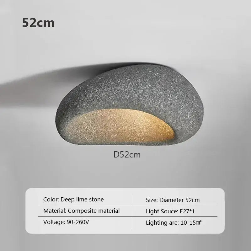 A sleek oval decorbites led ceiling light in textured deep lime stone composite with warm gold led glow for indoor use