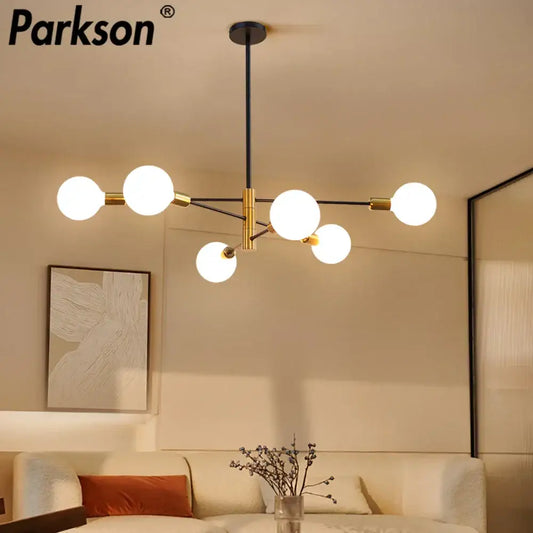 Parkson brand modern decorbites led ceiling light features five frosted glass bulbs on a black and brass metal frame