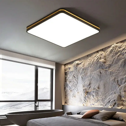 Modern decorbites led ceiling light with sleek black metal frame gold trim emitting bright white illumination