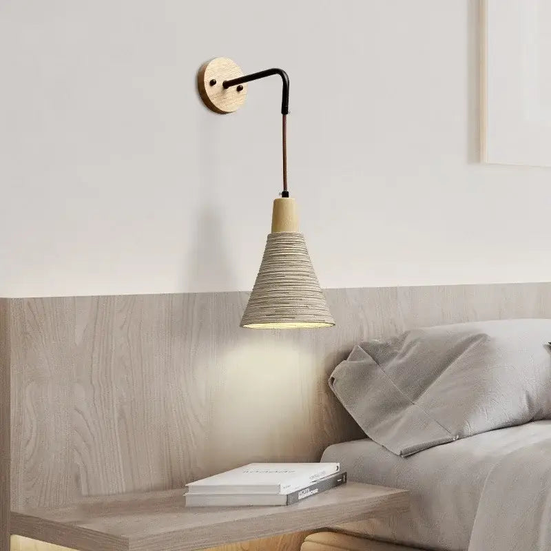Minimalist decorbites led cement wall light with natural wood base black metal arm and woven beige rope shade