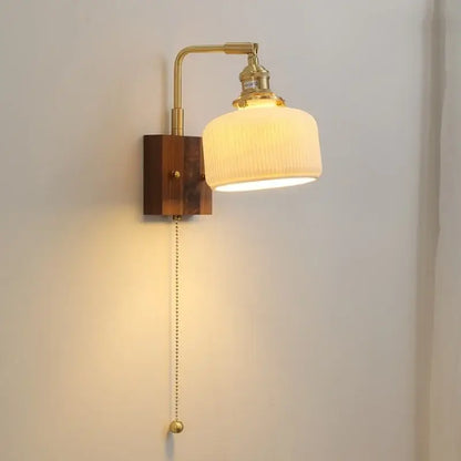 Brass-finished decorbites led ceramic wall sconce with ribbed off-white glass shade and wooden base light fixture