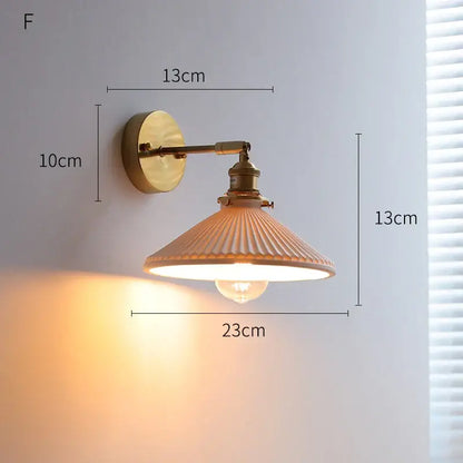 DecorBites led ceramic wall sconce with vintage brass finish and ribbed translucent glass shade for bedroom lighting