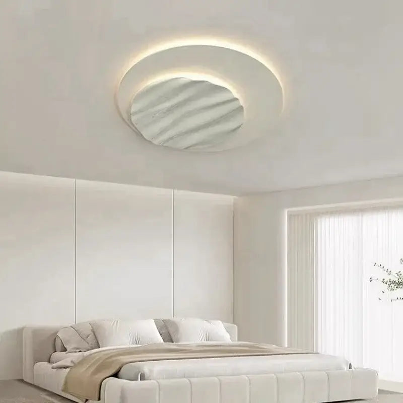Modern DecorBites LED chandelier ceiling light with a soft glowing ring and wavy textured mirrored panel