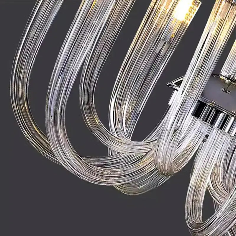 Modern chrome lighting fixture featuring curved transparent glass filaments decorbites led chandelier for bedroom