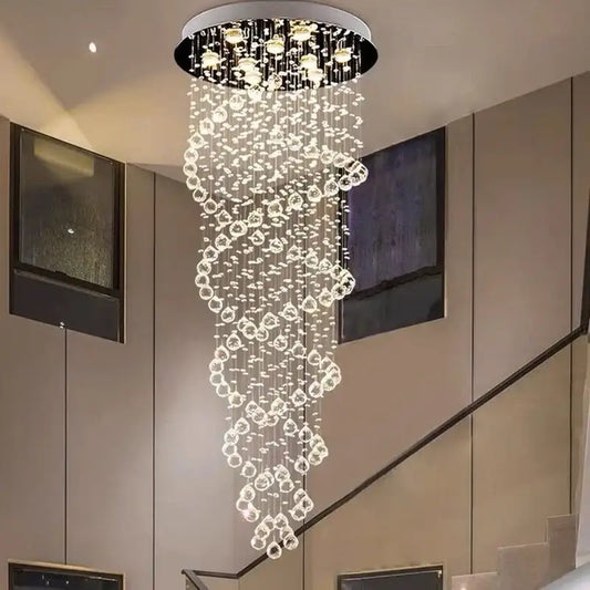 A modern circular decorbites led chandelier with cascading clear crystal beads and warm led lights for luxury decor