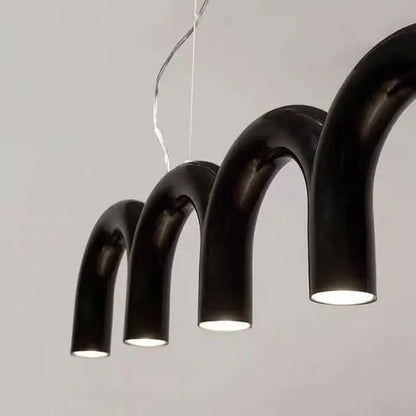 Modern black curved pendant lights with glossy finish and warm interior illumination in decorbites led chandelier design