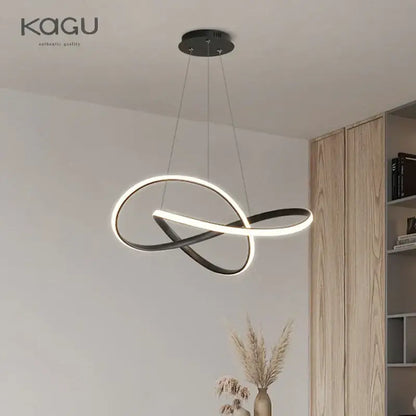 Decorbites led chandelier light features a black and white infinity loop design in aluminum and acrylic for modern dining