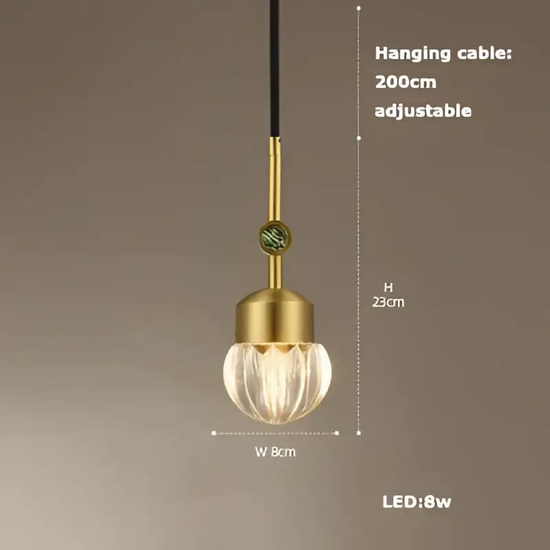 Gold-toned DecorBites LED chandelier lighting with textured faceted glass globe and adjustable black cable for dining room