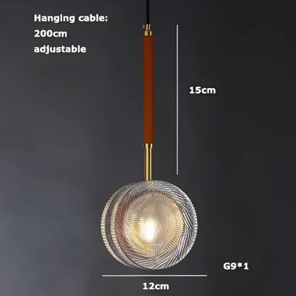 A modern glass decorbites led chandelier with circular textured design and warm golden glow for dining room lighting