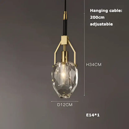 A modern decorbites led chandelier with a faceted crystal glass shade and brass-finished frame for dining room lighting