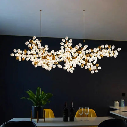 Gold-toned DecorBites LED chandelier lighting with frosted glass globes resembling blossoms for living room and bedroom