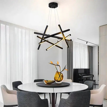 Modern black and gold geometric decorbites led chandelier lighting with intersecting rods for indoor living and dining spaces