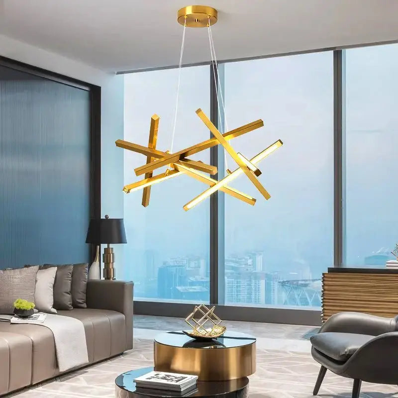Gold-colored modern decorbites led chandelier with intersecting geometric bars for living and dining room lighting