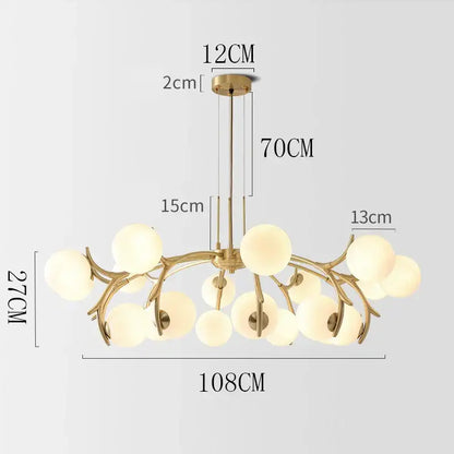 Gold-toned DecorBites LED chandelier lighting with branching metal frame and frosted glass globe shades for living room decor
