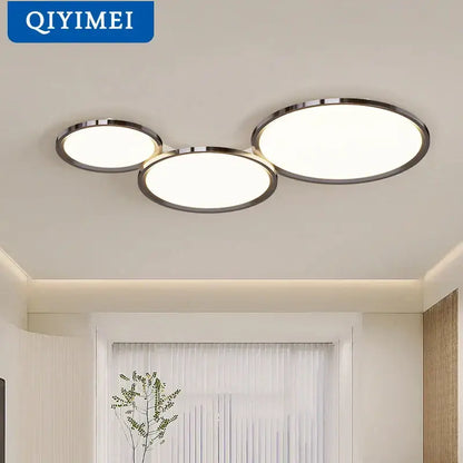 Modern gold-framed decorbites led chandelier with three overlapping illuminated panels for indoor living spaces