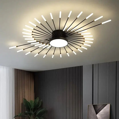 Modern black and brass decorbites led chandelier with frosted led rods radiating from a circular fixture for indoor use