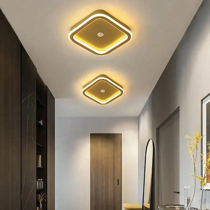 Two modern square decorbites led chandelier lights with gold frame and warm yellow led glow for indoor lighting