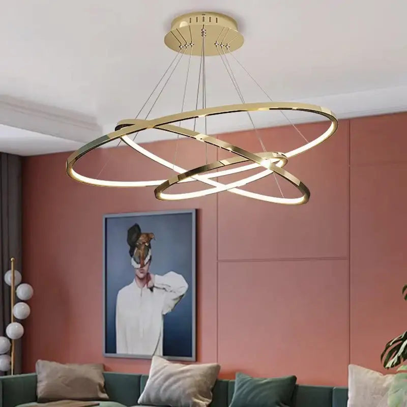 Gold-toned decorbites led chandelier pendant light with interlocking circular rings and integrated led lighting for indoor use